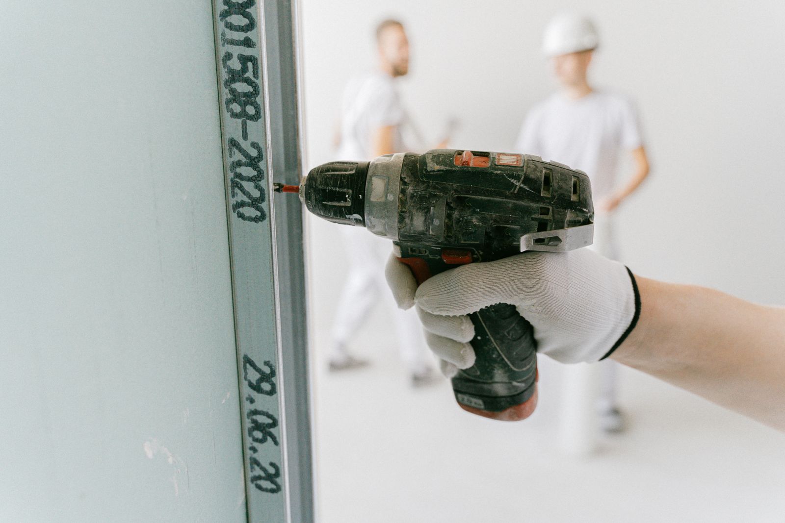Illustrative drywall drilling for a small apartment maintenance task
