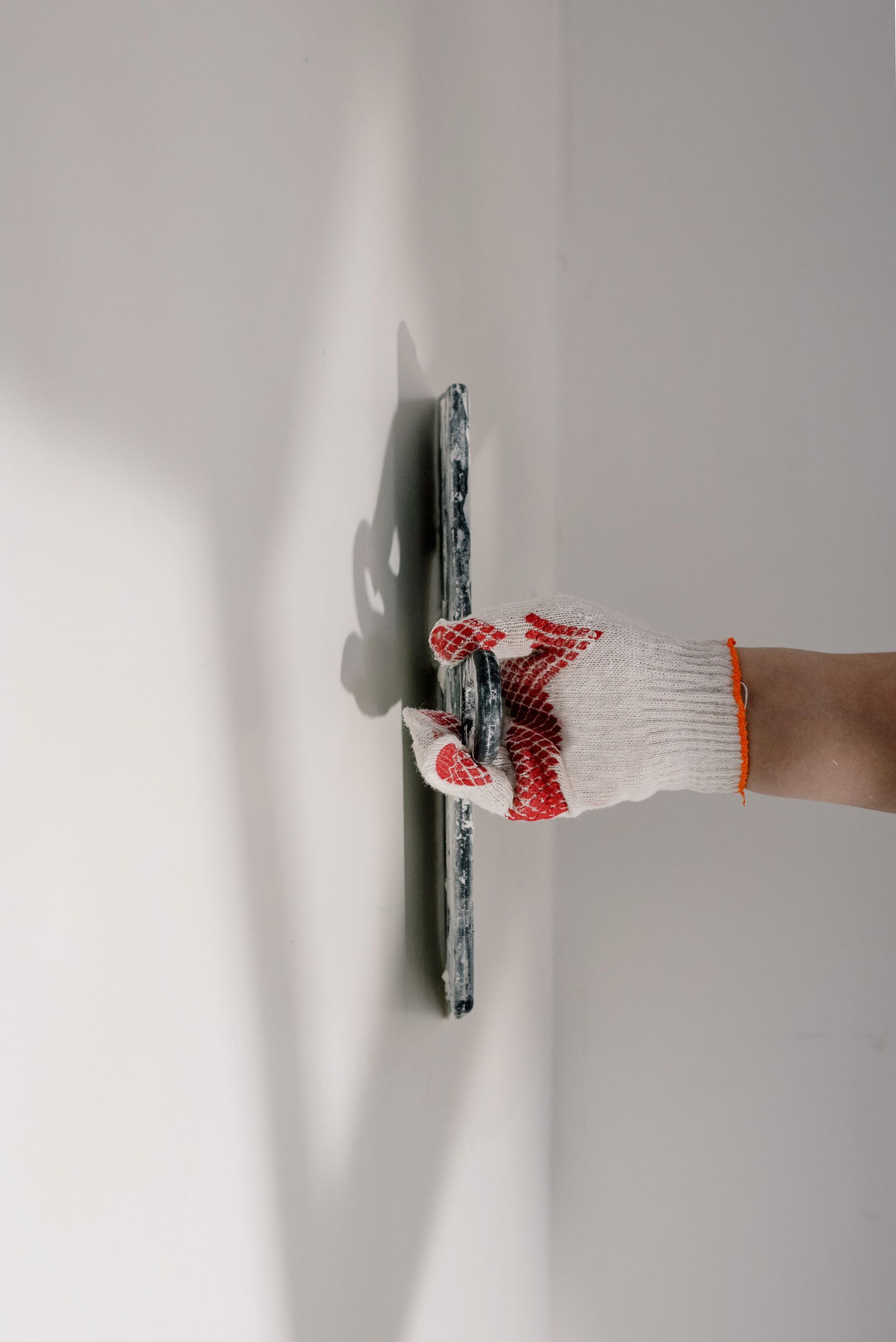 Trowel smoothing plaster during wall repair